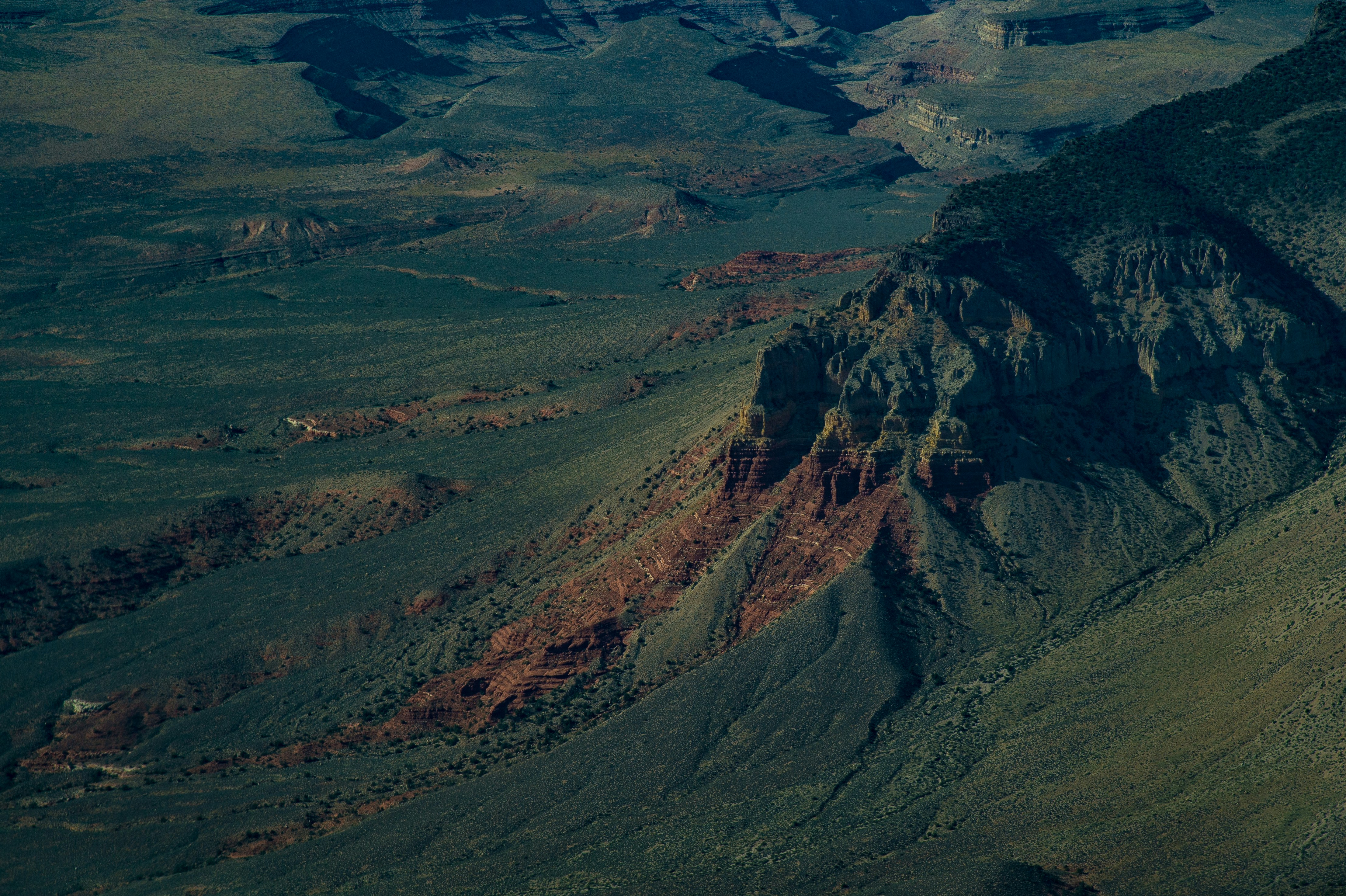 green and brown mountains under blue sky during daytime