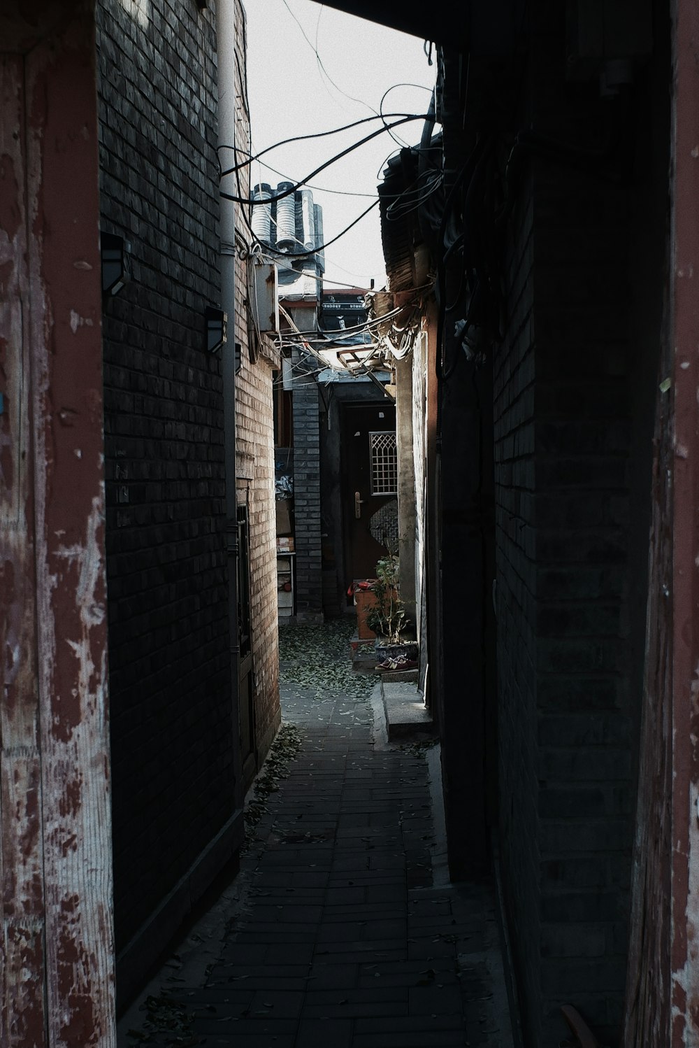 brown brick building with black metal gate