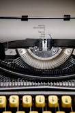 black and white typewriter on white table