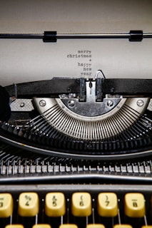 black and white typewriter on white table