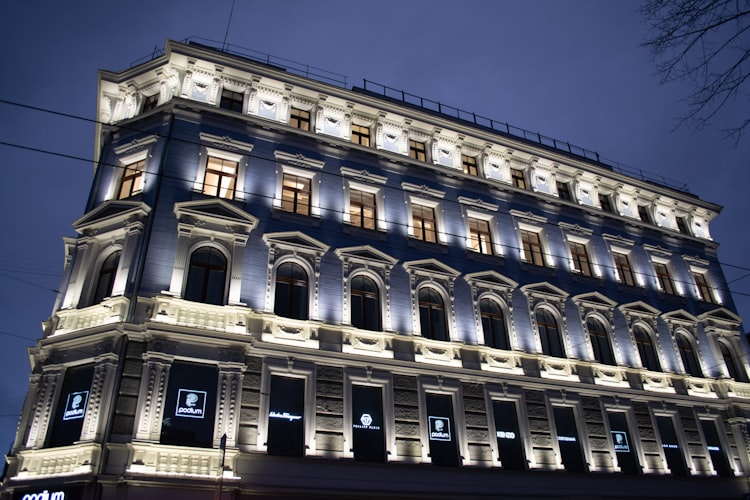 A beautiful lit building in the center of Riga.