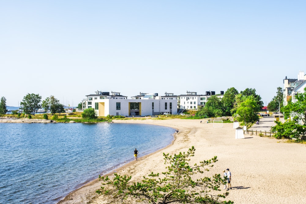 white concrete building near body of water during daytime