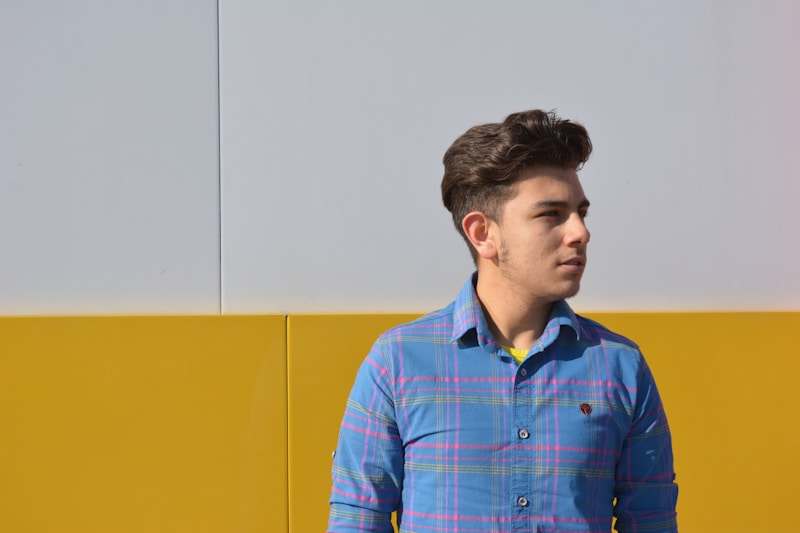 man in blue and yellow plaid dress shirt