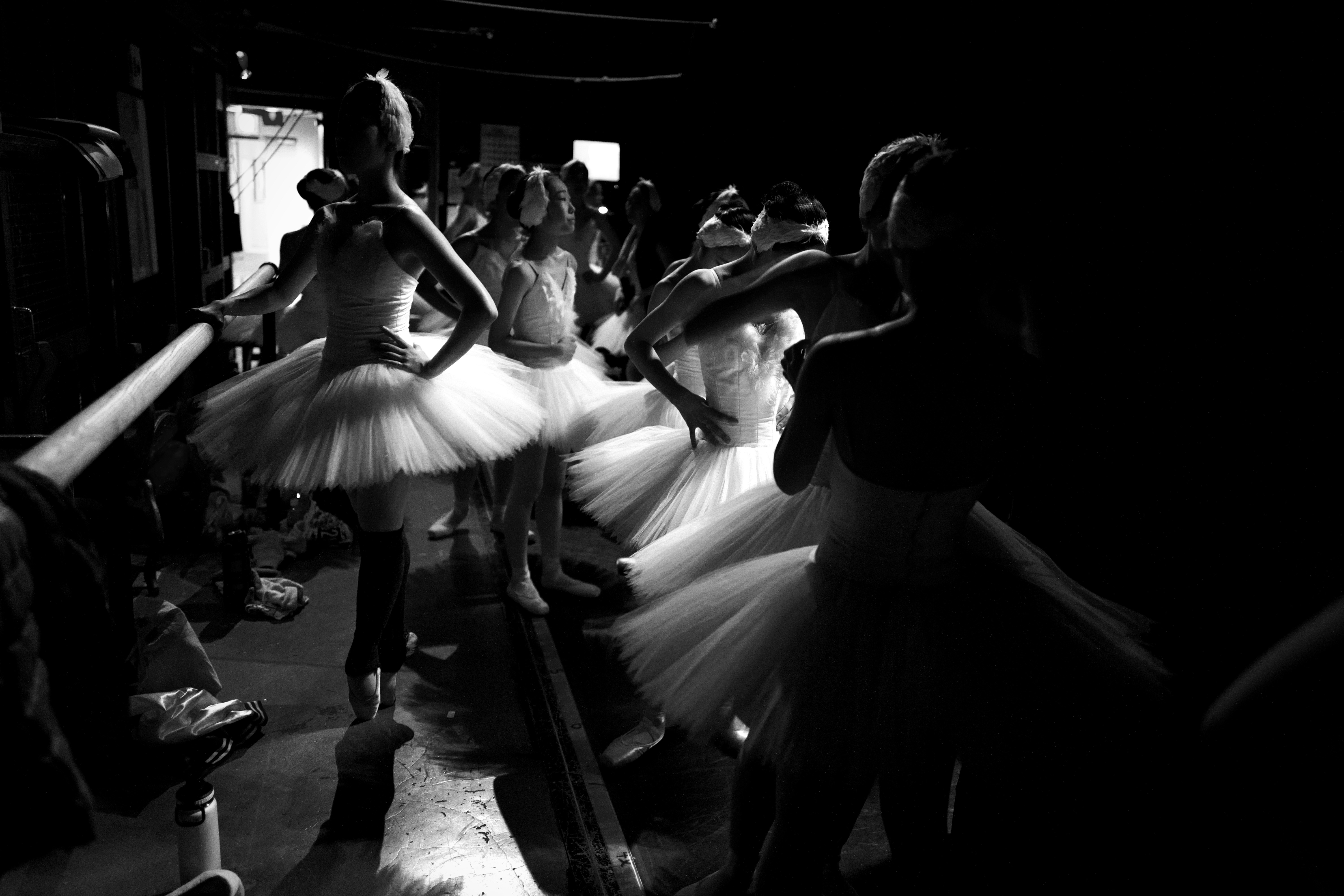 woman in white dress dancing on the street
