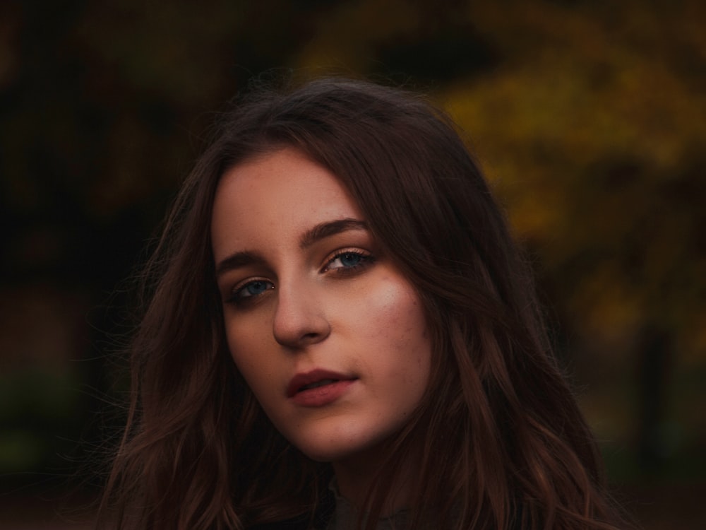 woman in brown shirt with brown hair