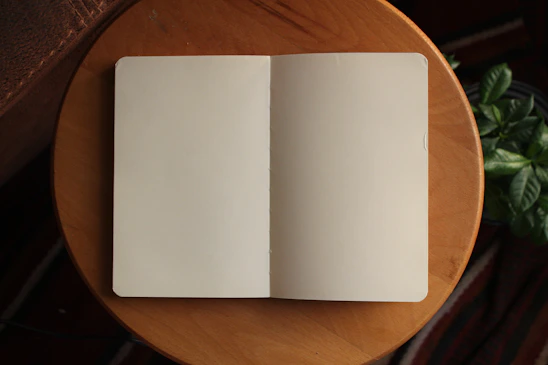 white printer paper on brown wooden table