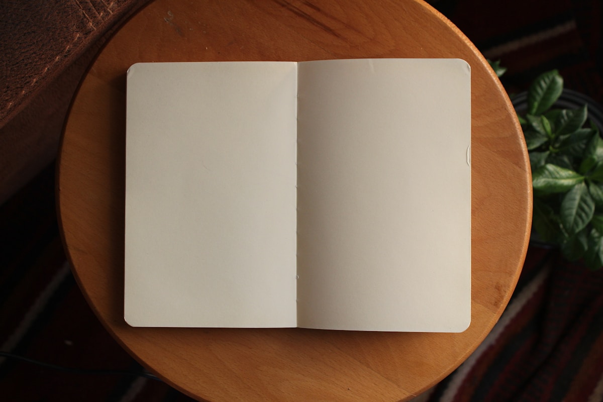 white printer paper on brown wooden table
