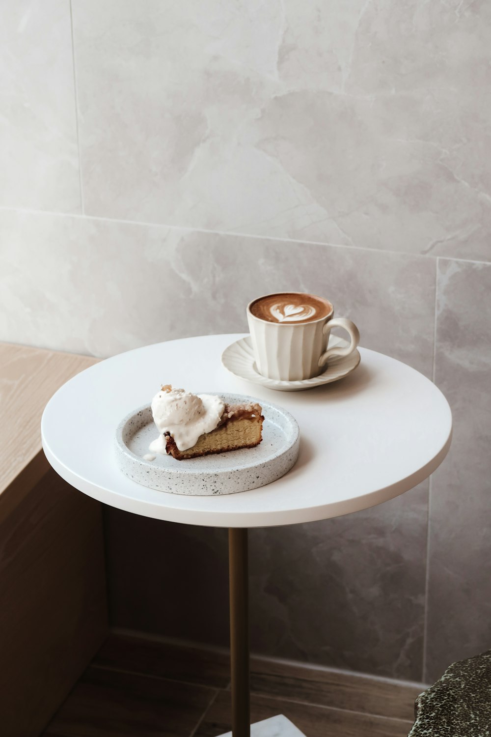 white ceramic mug on white ceramic plate