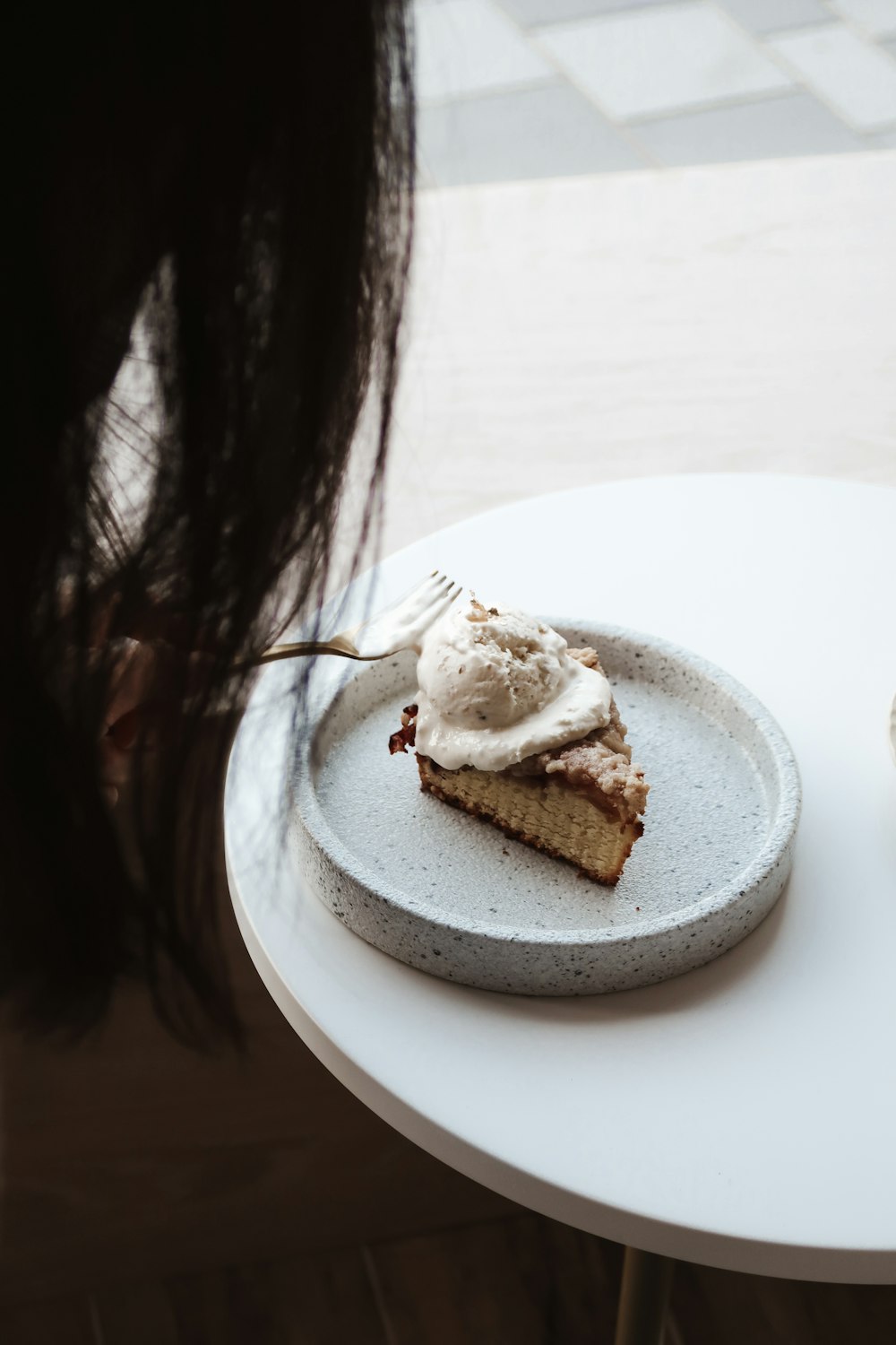 sliced of cake on white ceramic plate