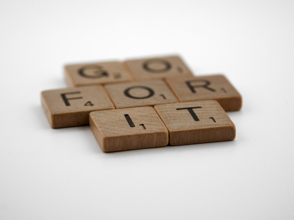 brown wooden number 8 on white surface