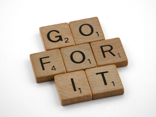 brown wooden blocks with go for it written