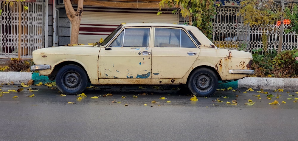 beige station wagon parked on parking lot during daytime