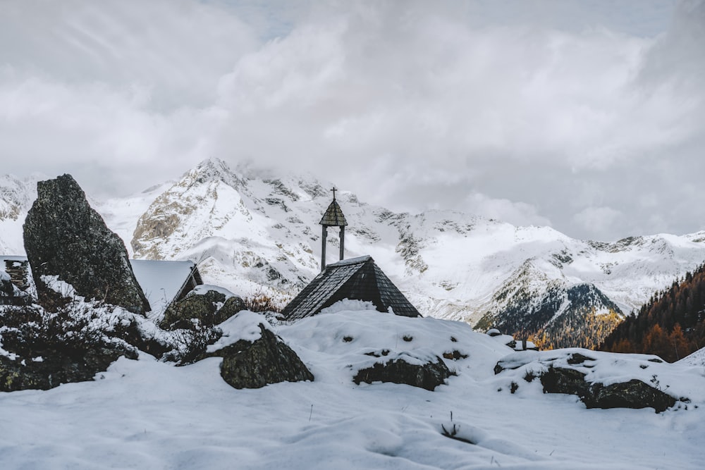 snow covered mountain under cloudy sky during daytime