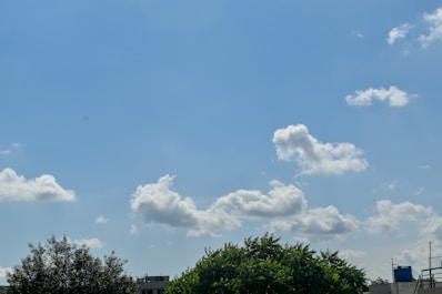 A close-up of a water tank with a blue sky.