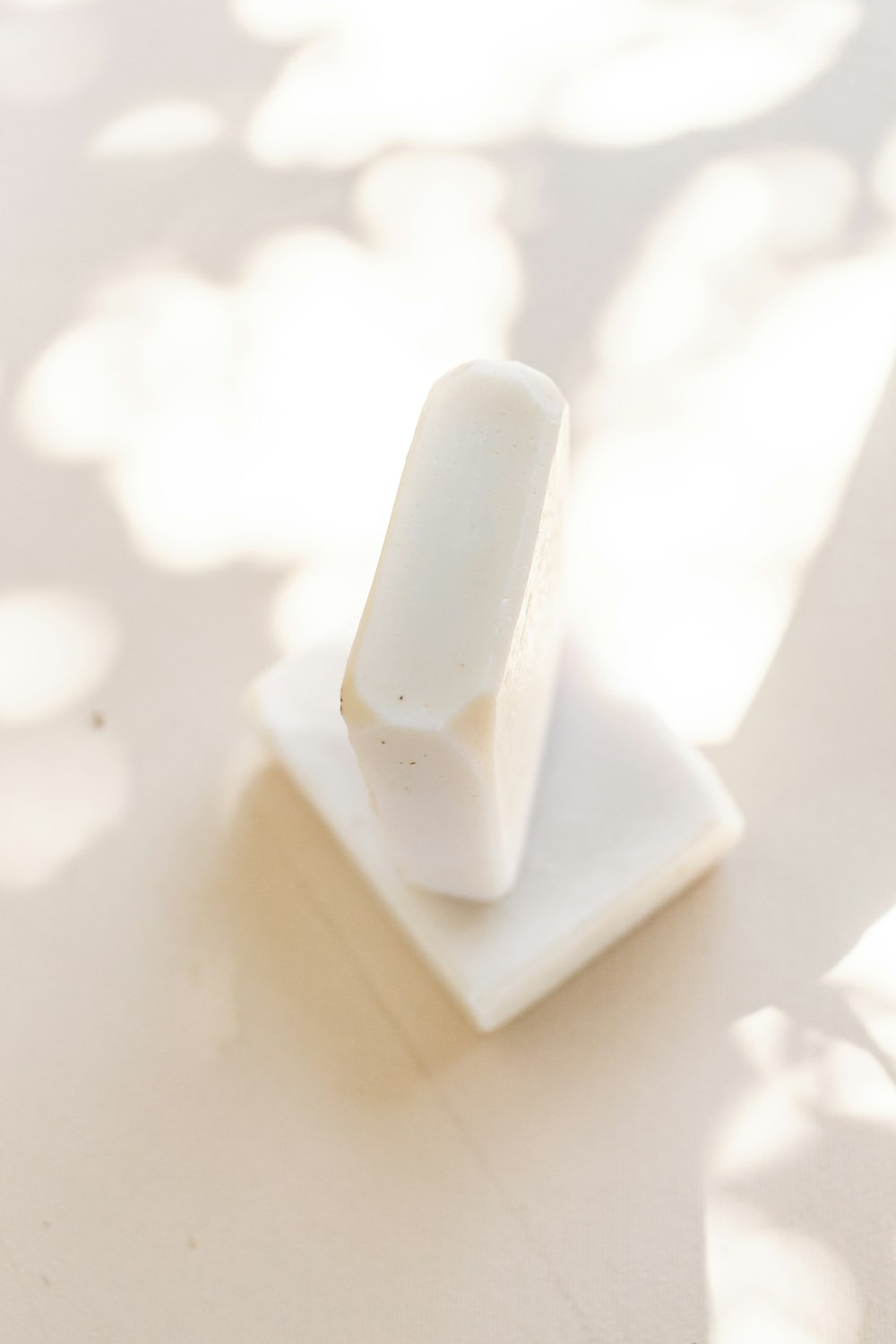 white plastic toy on white surface