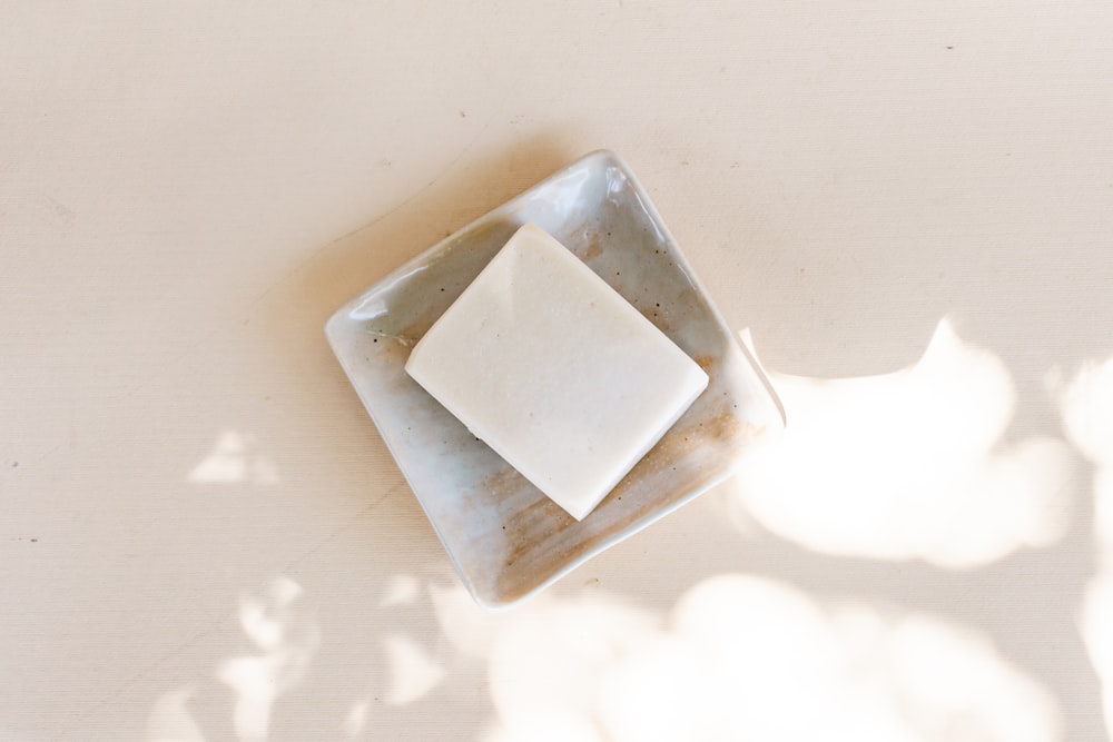 white square container on white table