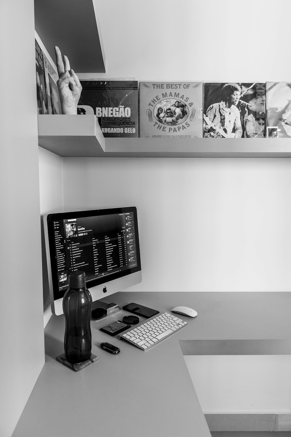 black flat screen computer monitor beside white and black ip desk phone