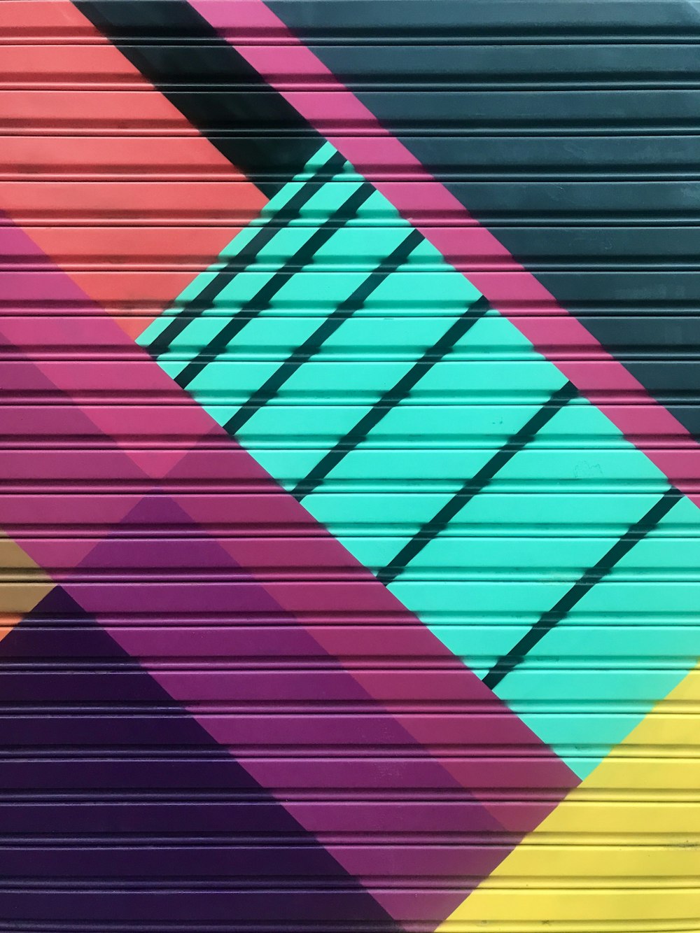 red yellow and purple striped wall