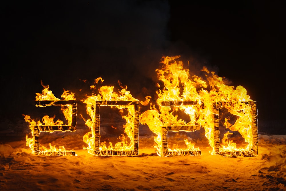 people standing on fire during night time