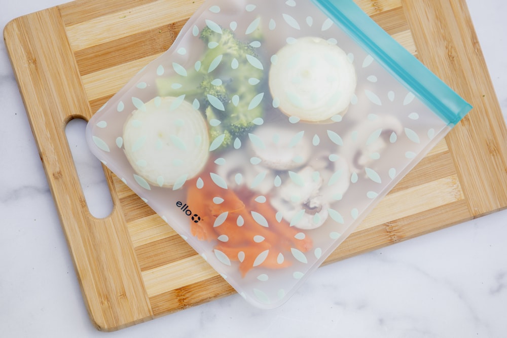 white ice cream on blue plastic container