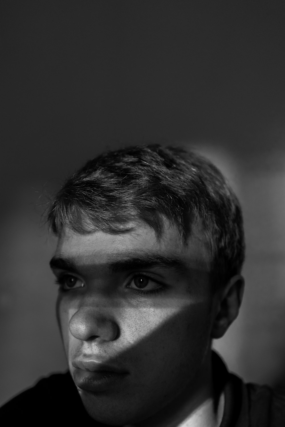 grayscale photo of mans face