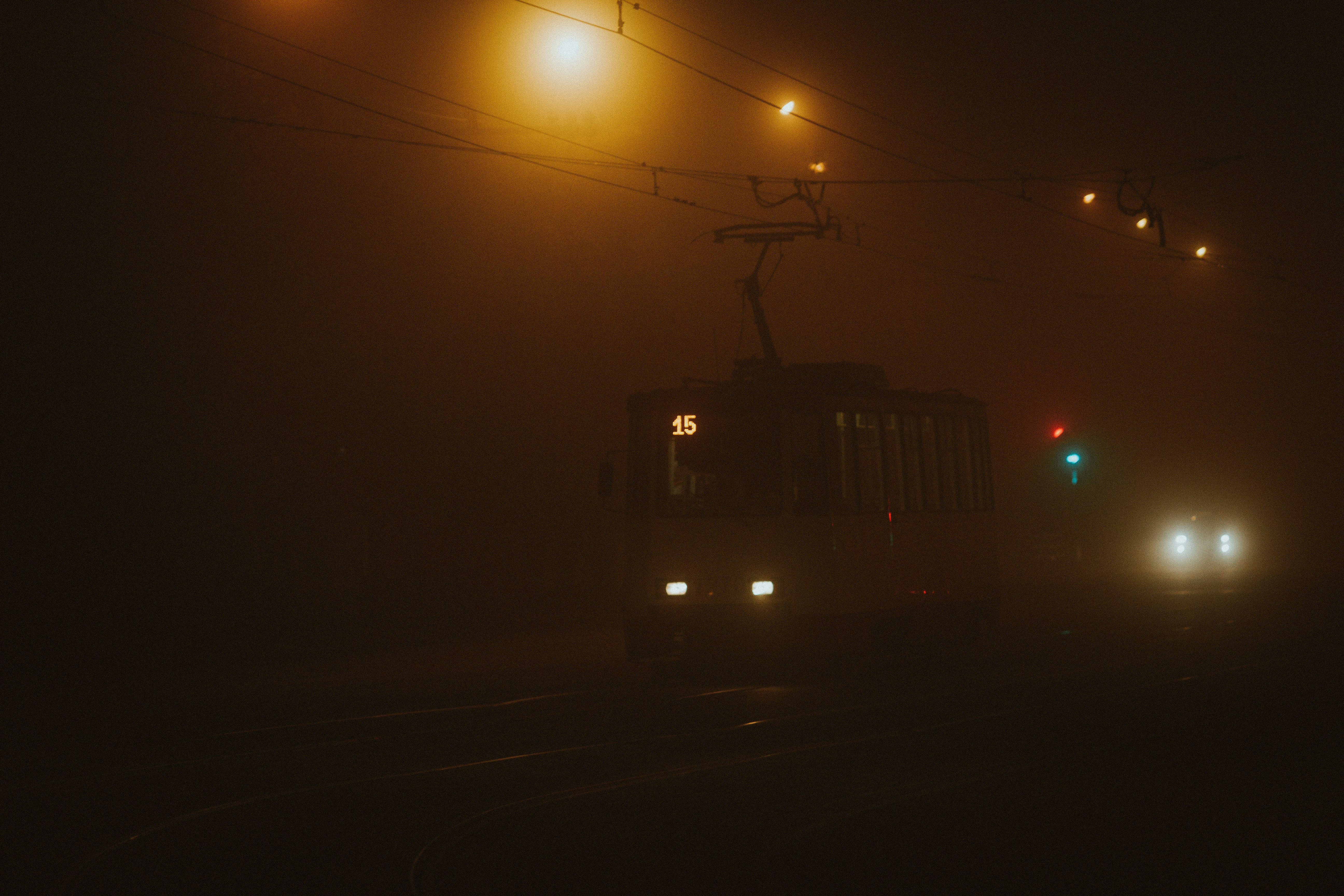 white train on rail road during night time