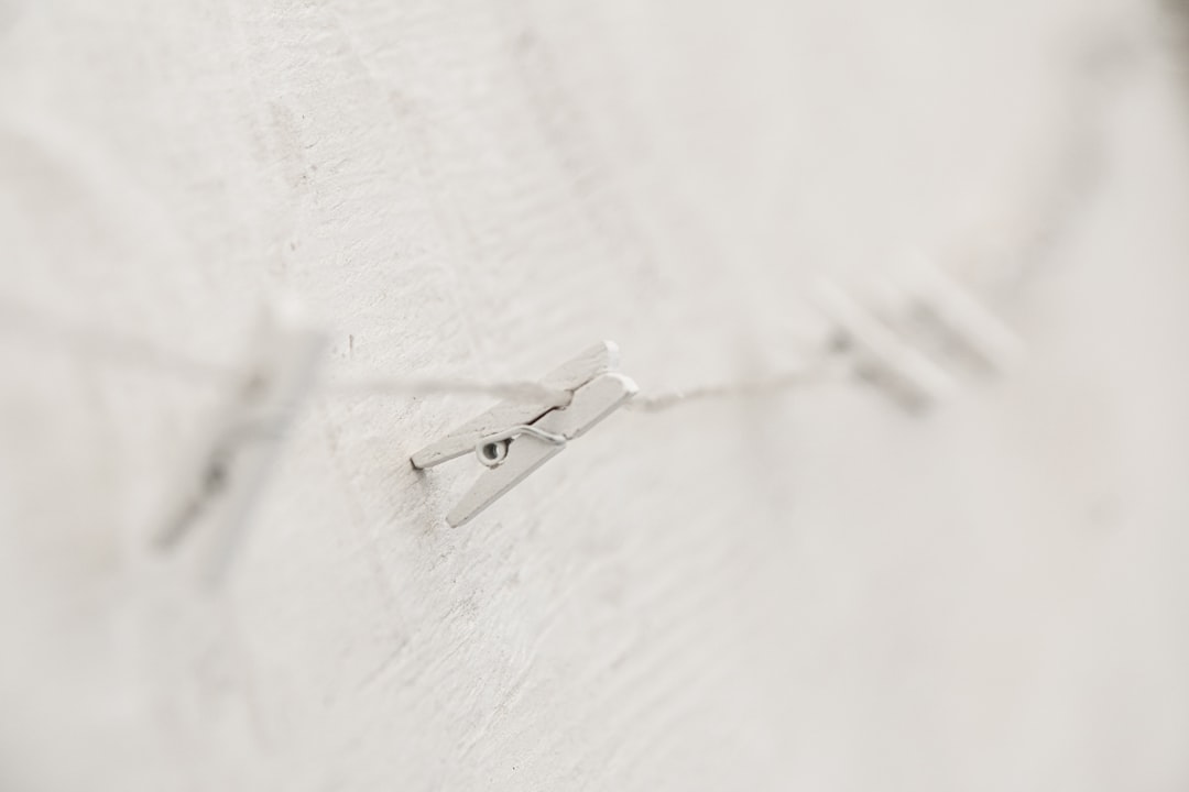 white clothes pin on white textile