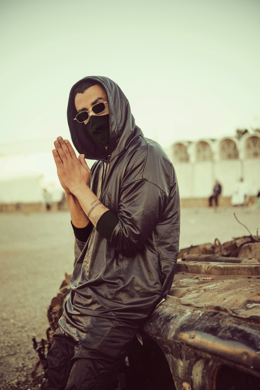 man in black leather jacket wearing black mask