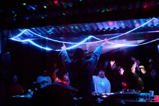 man in black long sleeve shirt standing on stage