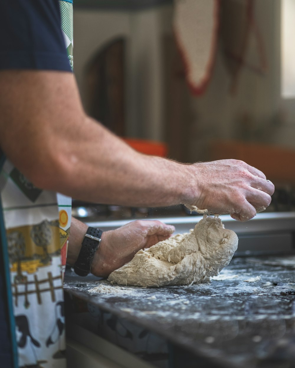 person holding dough on table