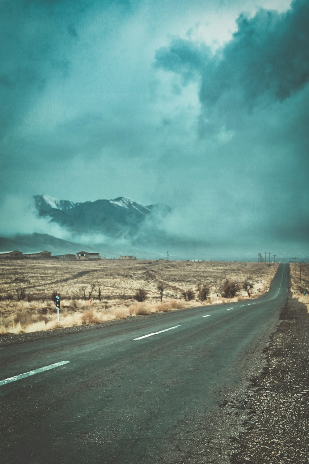 gray asphalt road under blue sky