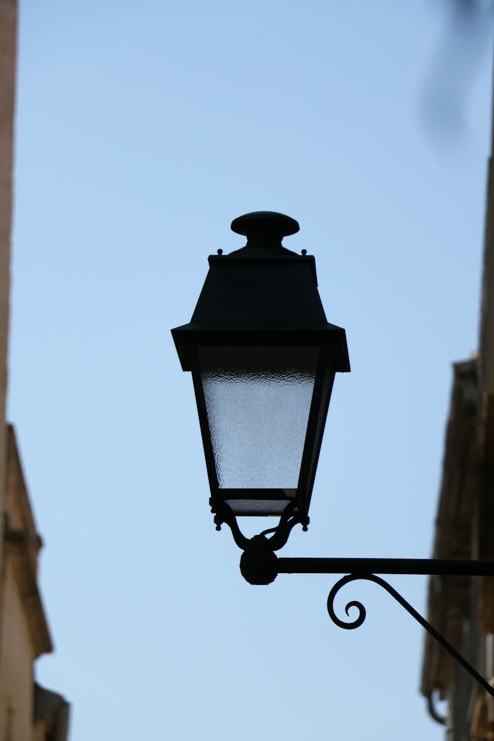 black outdoor lamp during daytime
