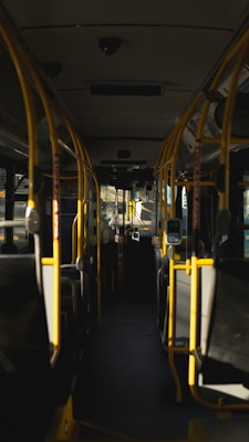 yellow and black train in train station