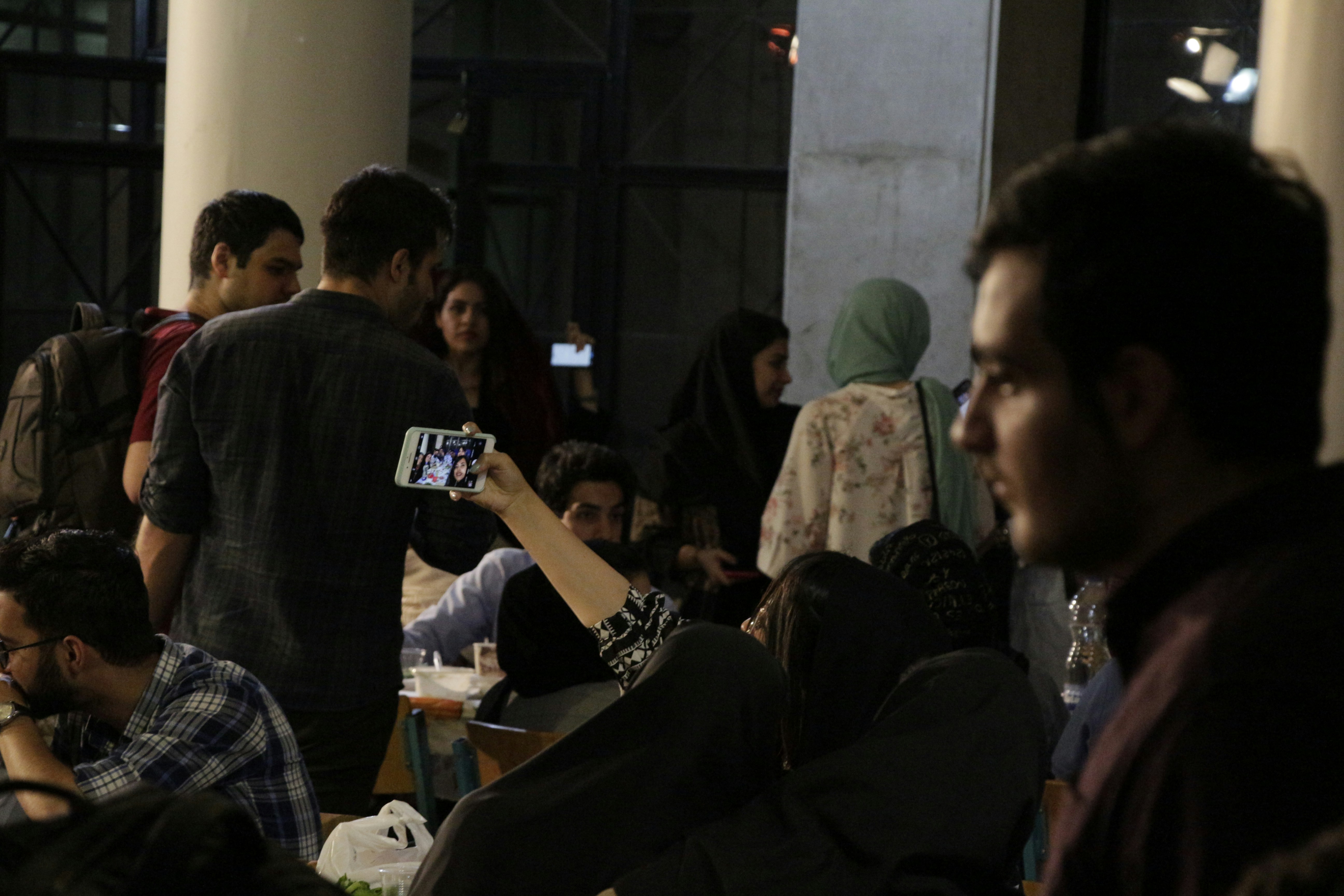 people sitting on chair in room
