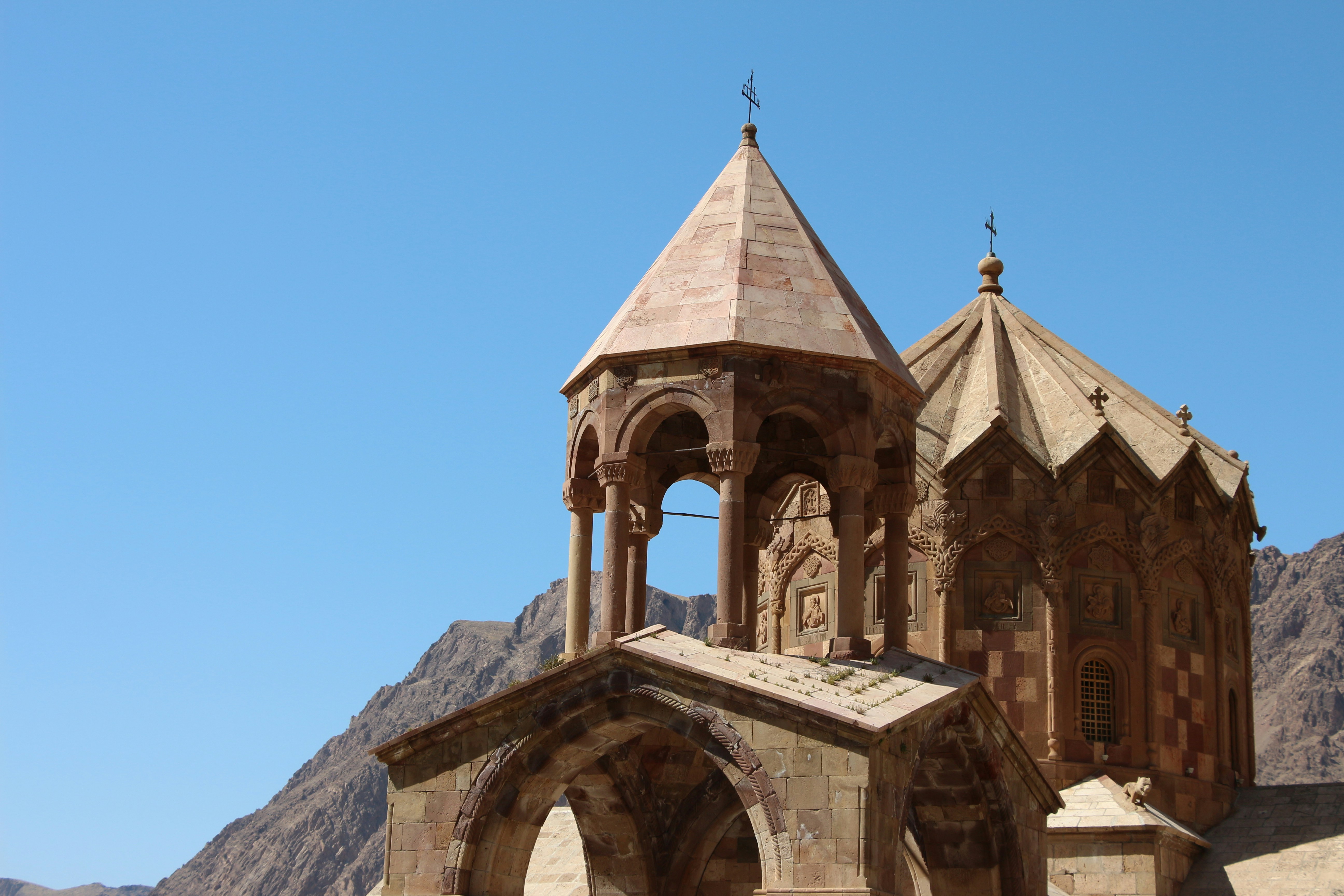 brown concrete building under blue sky during daytime