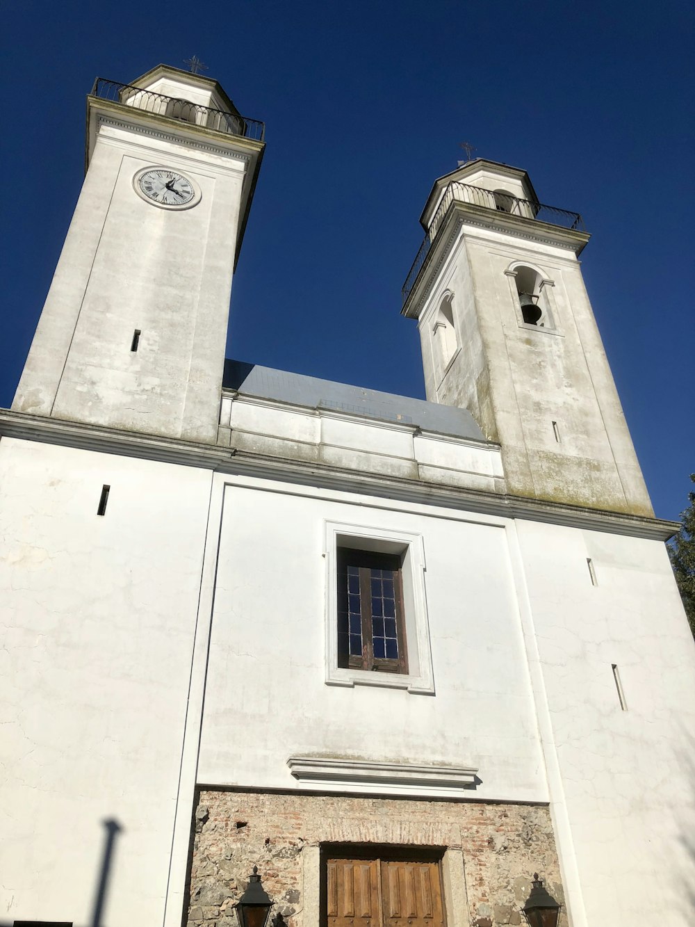 white concrete building under blue sky during daytime