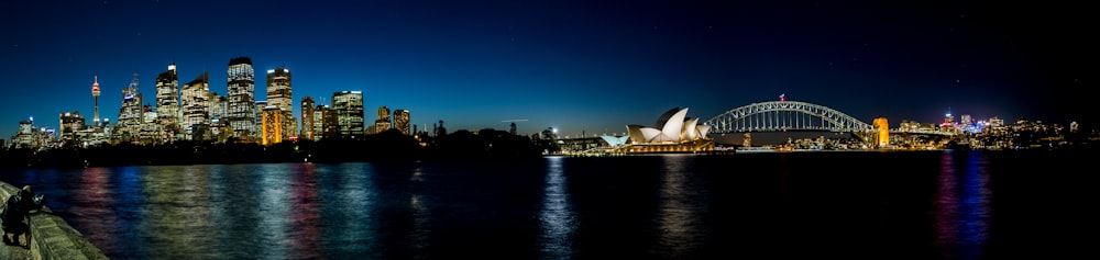 white building near body of water during night time