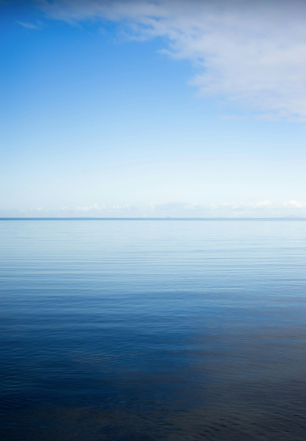 blue sea under blue sky during daytime