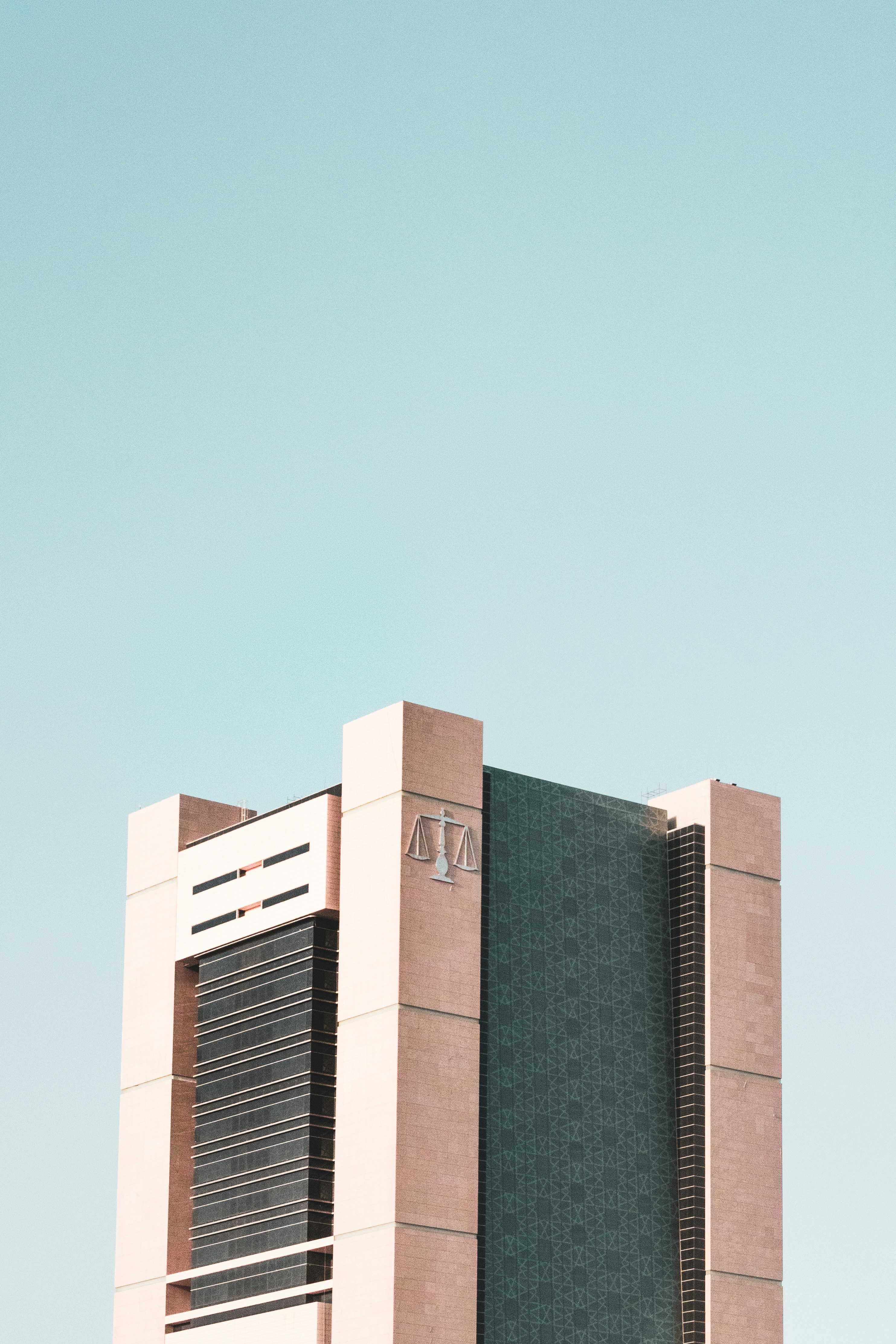 brown concrete building under blue sky during daytime