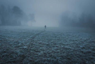 Early morning mist hovering over Stare Wierchy with a silhouette of a walker.