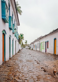 A narrow street in Marmato lined with colorful colonial-style houses.