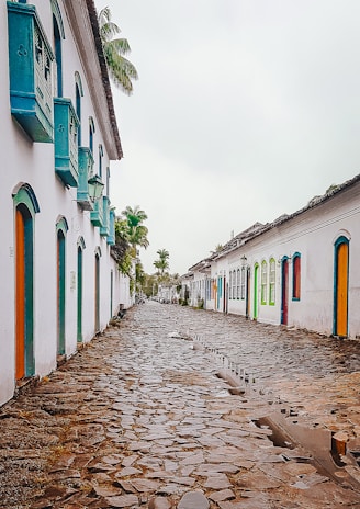 A narrow street in Marmato lined with colorful colonial-style houses.