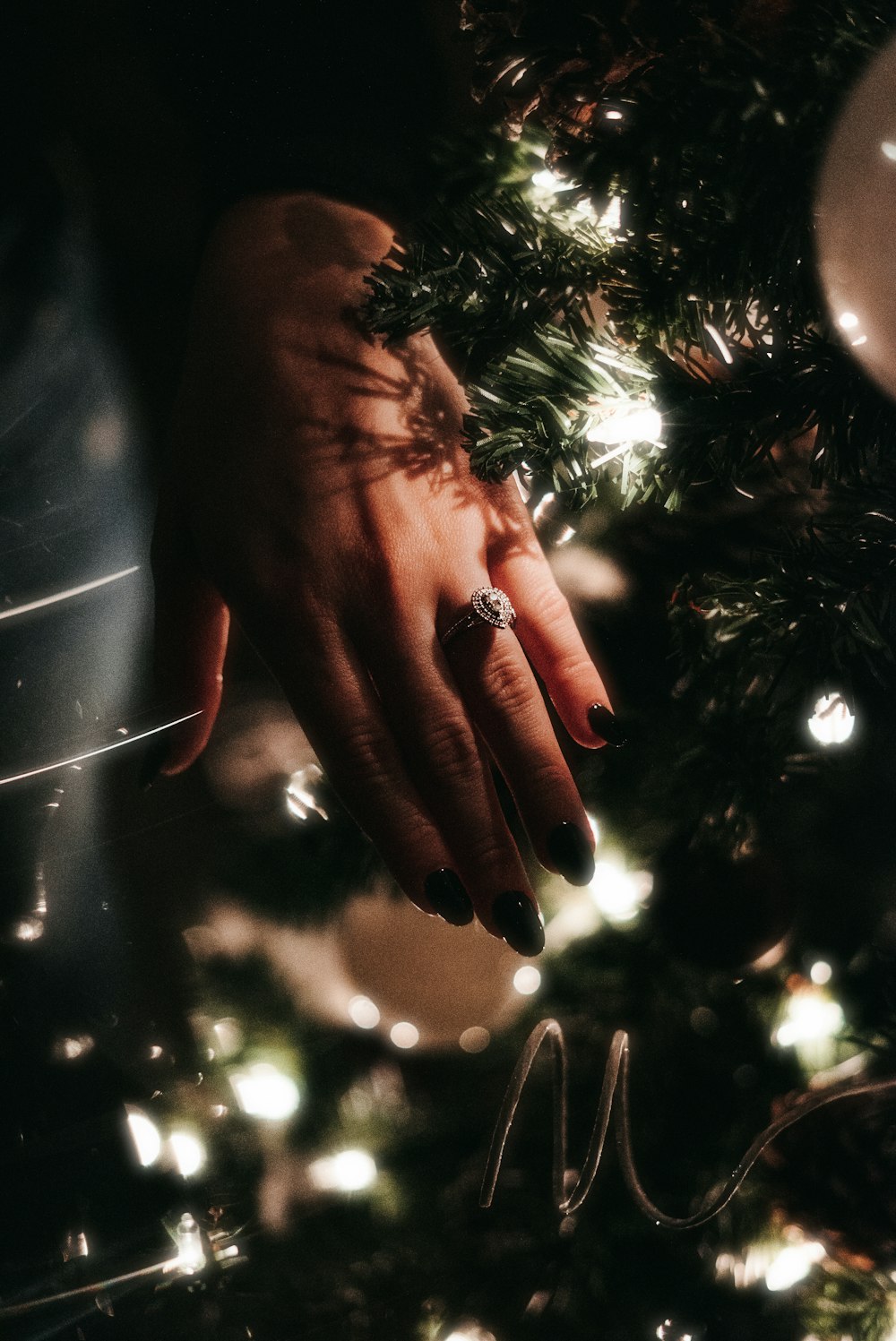 person wearing silver diamond ring