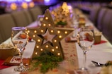 gold star ornament on green christmas tree