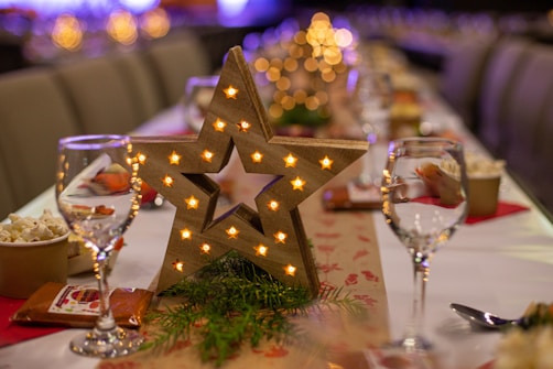gold star ornament on green christmas tree