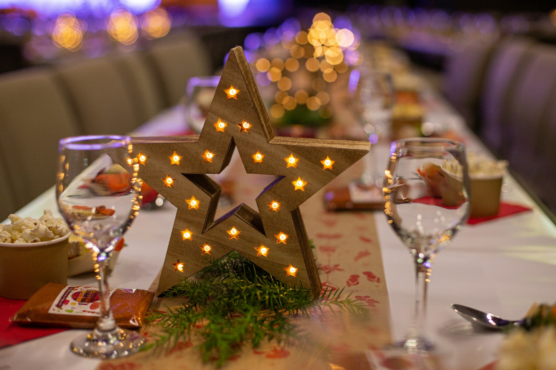 gold star ornament on green christmas tree