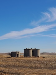 Wide shot of a completed silo base with surrounding farmland.