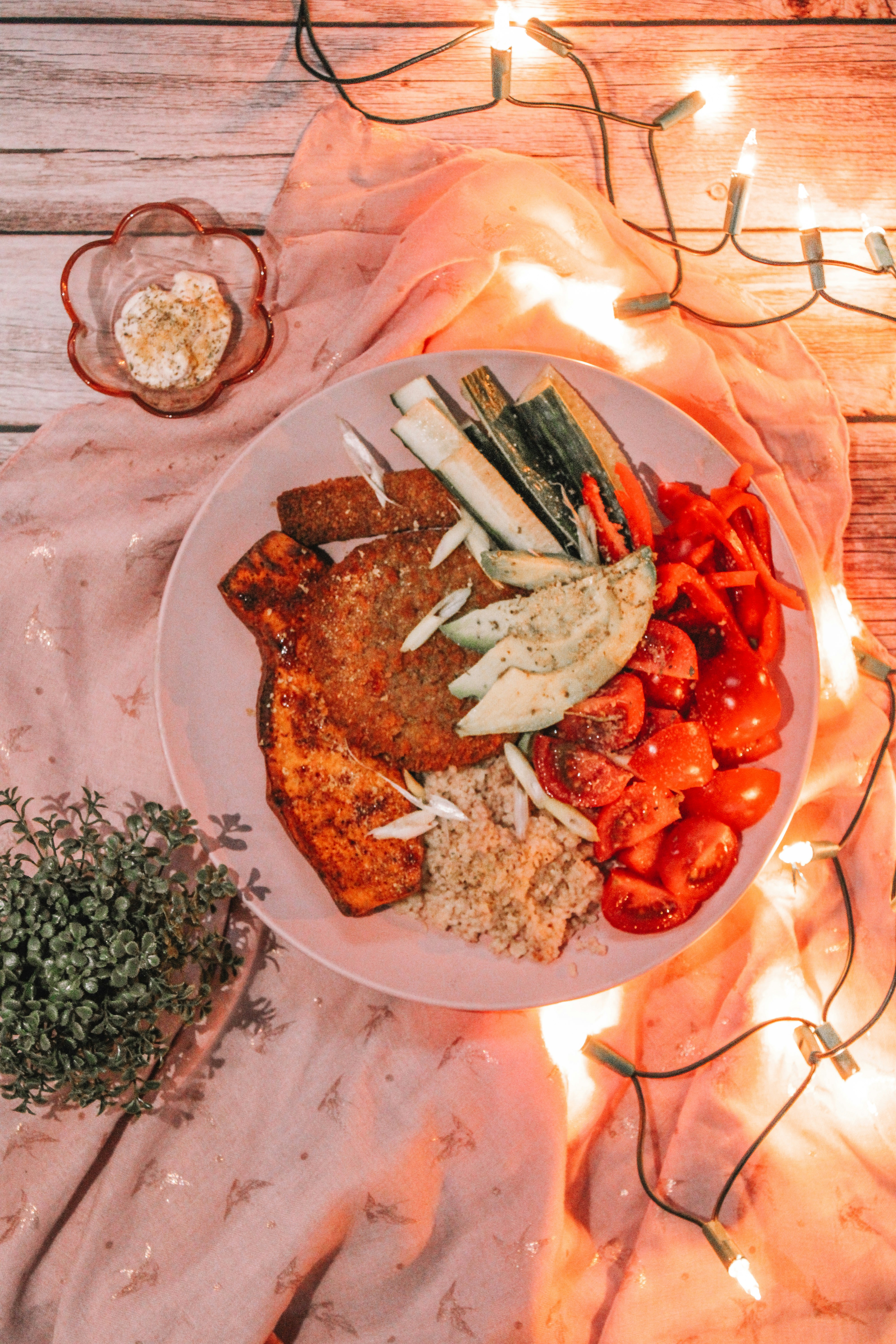 Beautifully plated seasonal dish with fresh colorful ingredients and artistic presentation in warm restaurant ambiance bright and airy",