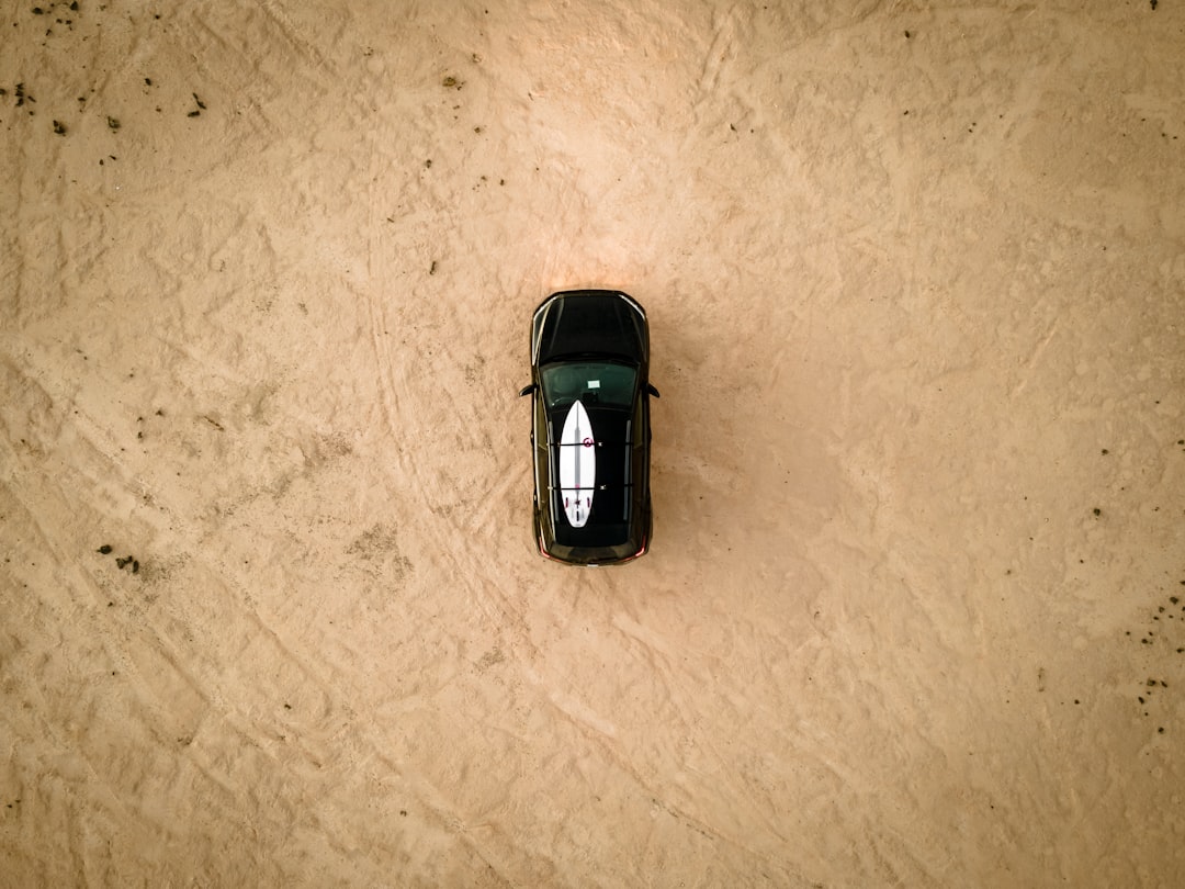 black car scale model on white surface