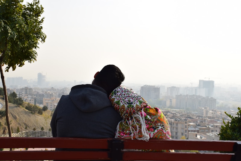 Couple on red bench abroad